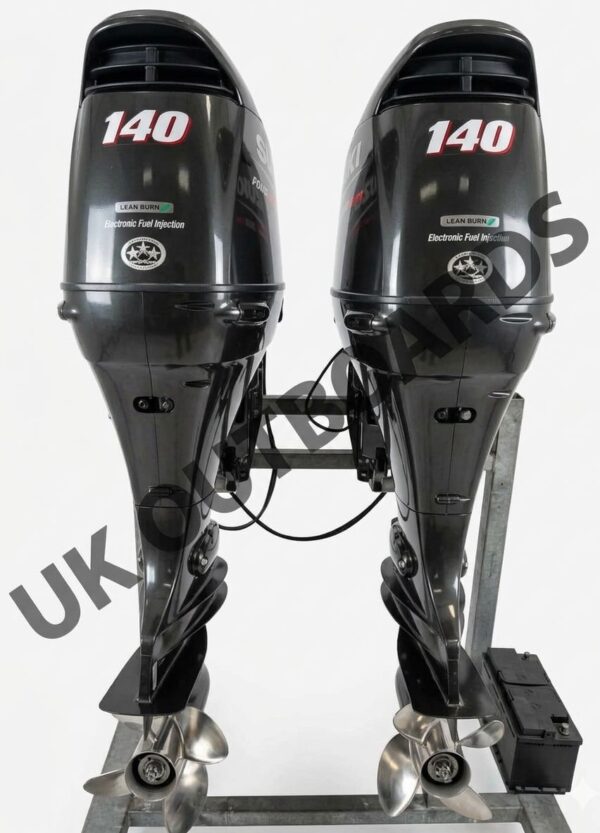 Tidy Suzuki 140hp Outboards - 2015 DF140A Twin Set 25 Inch Shaft Marine Motors Rear transom view of a tidy suzuki 140hp outboards dual installation showcasing two clean matching gloss black 4-stroke motor cowlings with silver graphics, mounted side by side with premium three blade stainless steel props.