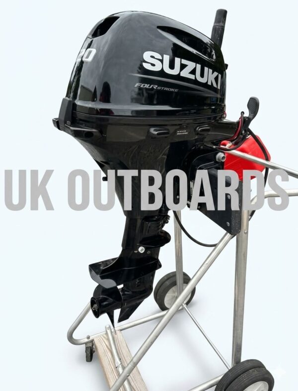 Studio profile of a clean suzuki 20hp motor showing the immaculate matte black engine cowl with white Suzuki 20 branding, ergonomic tiller handle, electric start assembly, and short shaft lower unit gearcase with propeller.