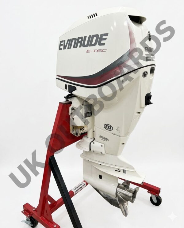 2023 Evinrude 225HP V6 EFI Outboard Motor - Premium EFI Marine Engine 2023 Evinrude 225HP V6 EFI Outboard Motor with a 25 inch extra-long shaft on a boat transom. The premium efi marine engine features a modern slate gray and black angular cowling design.